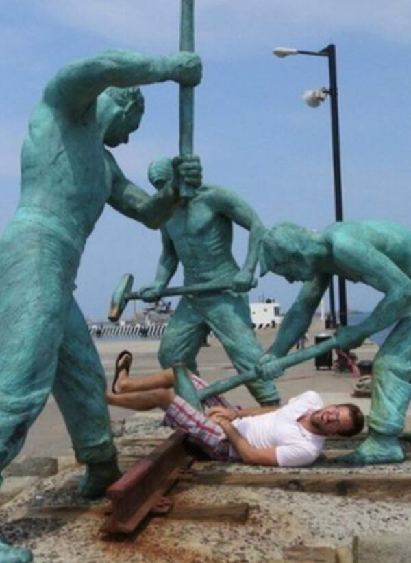 people having fun with statues 1