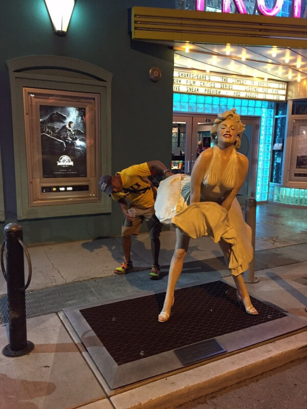 people having fun with statues 10