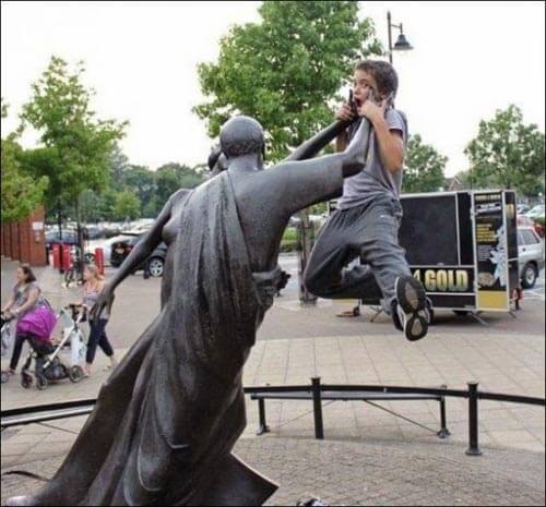 people having fun with statues 15
