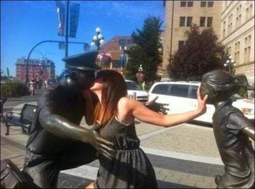 people having fun with statues 20