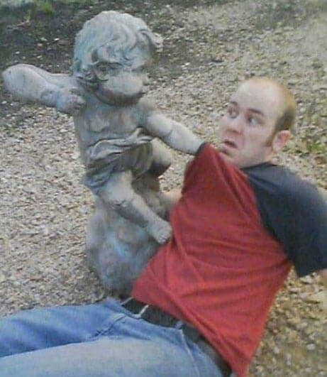 people having fun with statues 24