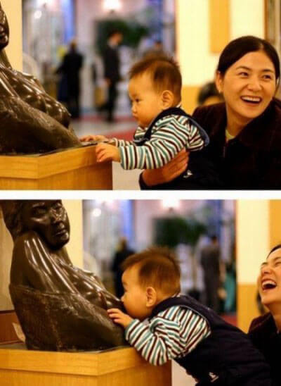 people having fun with statues 27